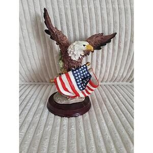 Patriotic Bald Eagle Figurine Perched On The American Flag